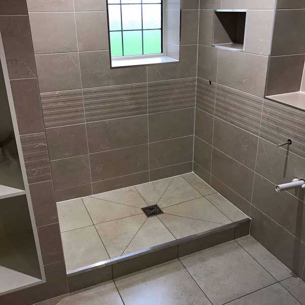 Fully-tiled-easy-access-bathroom-in-mushroom-beige-600x600