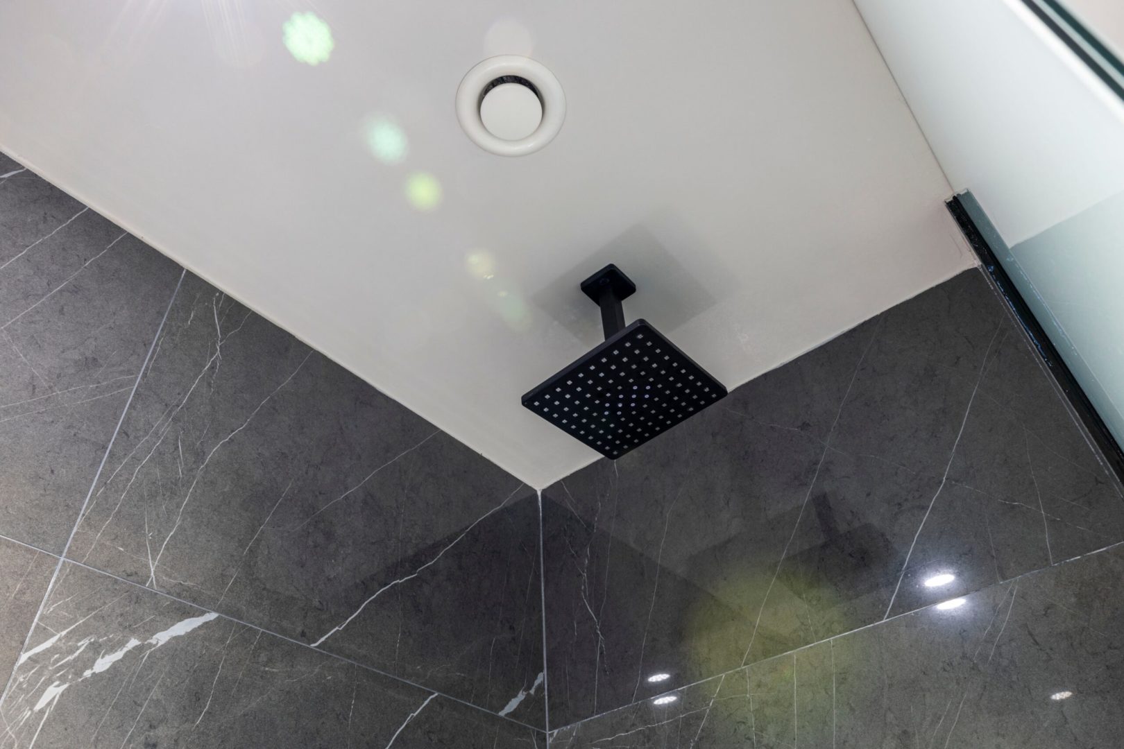 Close,Up,View,Of,Bathroom,Ceiling,With,Modern,Shower,And