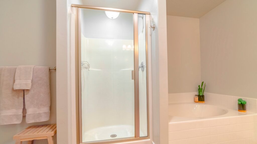 brass-shower-frame-in-white-bathroom